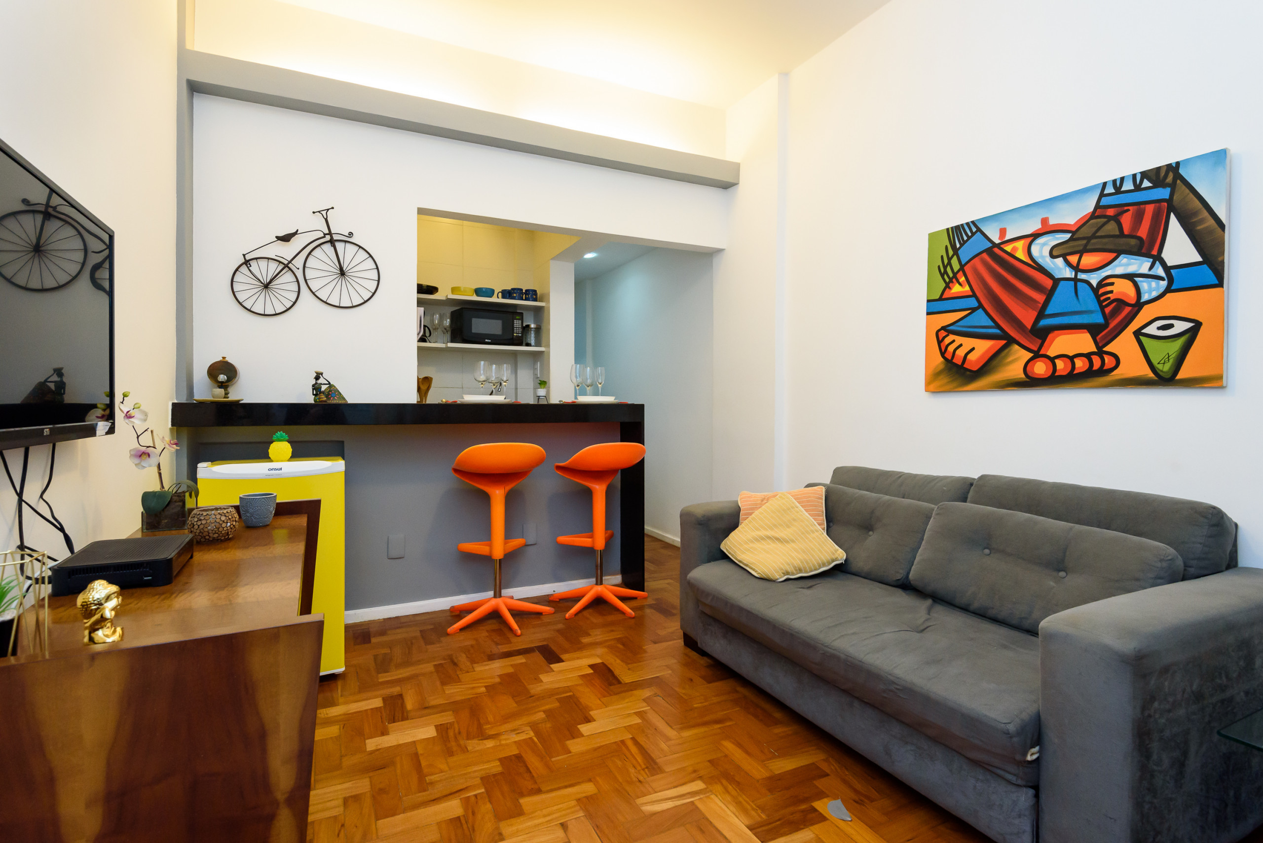 Living room with TV and sofa.